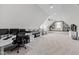 Large bonus room with custom built-ins, ample seating, and a dedicated office space at 1636 Sweetwater Ln, Raleigh, NC 27610