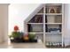 Cozy bookshelf with colorful books, and sitting area creating a charming reading nook at 1636 Sweetwater Ln, Raleigh, NC 27610