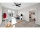 Spacious craft room with large window, ceiling fan, and ample space for creative projects at 1636 Sweetwater Ln, Raleigh, NC 27610