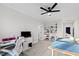 Bright room with table, sewing machine, built in shelves, and large window at 1636 Sweetwater Ln, Raleigh, NC 27610