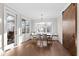 Dining room with table and chairs, plus view to deck and sliding barn door at 1636 Sweetwater Ln, Raleigh, NC 27610