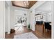 Bright foyer showcasing hardwood floors, an elegant ceiling design, and open access to the living spaces at 1636 Sweetwater Ln, Raleigh, NC 27610