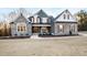 Charming craftsman-style home featuring stone accents, shuttered windows, and a well-manicured front yard at 1636 Sweetwater Ln, Raleigh, NC 27610