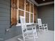Cozy front porch featuring rocking chairs, perfect for relaxing and enjoying the outdoor scenery at 1636 Sweetwater Ln, Raleigh, NC 27610