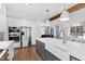 Kitchen with island sink, stainless steel appliances, and an open floor plan at 1636 Sweetwater Ln, Raleigh, NC 27610