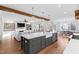 Spacious kitchen with island that opens into the breakfast nook, living room, and a white sofa at 1636 Sweetwater Ln, Raleigh, NC 27610
