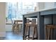 Close up view of the kitchen island with wooden barstools at 1636 Sweetwater Ln, Raleigh, NC 27610