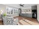 Inviting living room with a kitchenette, large windows, and stylish patterned armchairs at 1636 Sweetwater Ln, Raleigh, NC 27610