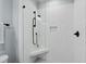 Modern shower with white subway tile, black fixtures, and a built-in corner seat at 1636 Sweetwater Ln, Raleigh, NC 27610