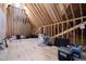 Large unfinished attic offering expansive storage space with exposed beams and insulation at 1636 Sweetwater Ln, Raleigh, NC 27610