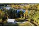 Aerial view showcasing a park area with a pond, walking path and shelter, blending recreation and nature at 182 Blue Butterfly Dr, Angier, NC 27501