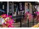 Charming storefront with decorative flowers and an 'Open' sign, inviting passersby and adding curb appeal at 182 Blue Butterfly Dr, Angier, NC 27501