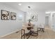 Cozy dining area with modern lighting and decor creates an inviting atmosphere for meals at 200 Arlington Cir Cir, Sanford, NC 27330