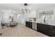 Bright kitchen features modern light fixture, stainless steel appliances, and a spacious eat-in area at 200 Arlington Cir Cir, Sanford, NC 27330