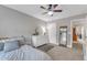 Cozy bedroom with a ceiling fan, dresser, accent mirror, and stylish decor at 2005 Cotton Barn Ct, Wendell, NC 27591