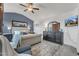 Bright bedroom features blue accent wall, carpet, and ceiling fan at 2005 Cotton Barn Ct, Wendell, NC 27591