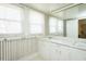 Bathroom featuring dual sinks, ample counter space, and vintage wallpaper at 204 N Sixth St, Mebane, NC 27302