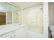 Bathroom featuring a shower-tub combo and vintage-style accents at 204 N Sixth St, Mebane, NC 27302