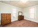 Bedroom featuring vintage-style dressers, natural light, and neutral color palette at 204 N Sixth St, Mebane, NC 27302