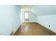 Bright bedroom with hardwood floors and a window providing natural light at 204 N Sixth St, Mebane, NC 27302