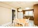Bright dining area with classic black and white flooring, table, and chairs at 204 N Sixth St, Mebane, NC 27302