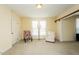 Sunny living room with neutral color palette, comfortable seating, and natural light at 204 N Sixth St, Mebane, NC 27302