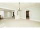 Bright and airy living room showcasing an open layout, neutral tones, and elegant lighting fixtures at 204 N Sixth St, Mebane, NC 27302