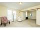Sunny living room with neutral color palette, comfortable seating, and natural light at 204 N Sixth St, Mebane, NC 27302