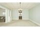 Bright living room with built-ins and access to additional rooms at 204 N Sixth St, Mebane, NC 27302