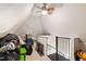 Attic with storage and a ceiling fan, providing potential for additional living space or ample storage solutions at 207 Linden Ave, Raleigh, NC 27601