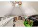 Spacious attic with ample storage and a ceiling fan, offering potential for future expansion and customization at 207 Linden Ave, Raleigh, NC 27601