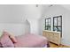 Charming bedroom with hardwood floors and window views at 207 Linden Ave, Raleigh, NC 27601