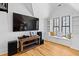 Bright entertainment room with a window seat and modern entertainment center at 207 Linden Ave, Raleigh, NC 27601