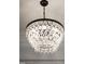 Close-up view of an ornate chandelier, adding a touch of elegance to the home at 207 Linden Ave, Raleigh, NC 27601