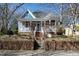 Charming two-story home with a landscaped front yard and welcoming front porch at 207 Linden Ave, Raleigh, NC 27601