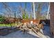 Stone backyard patio with firepit and seating at 207 Linden Ave, Raleigh, NC 27601
