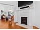 Elegant fireplace with decorative tile, adding character to the bright and open living space at 207 Linden Ave, Raleigh, NC 27601