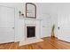 Charming vintage fireplace with pink tile accents and hardwood floors at 207 Linden Ave, Raleigh, NC 27601