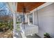 Relaxing front porch featuring a porch swing with black and white pillows at 207 Linden Ave, Raleigh, NC 27601
