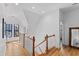 Bright and airy hallway with hardwood floors, white walls, and large windows, creating a welcoming and open space at 207 Linden Ave, Raleigh, NC 27601