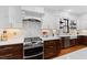 Bright, modern kitchen features stainless steel oven and white subway tile backsplash at 207 Linden Ave, Raleigh, NC 27601