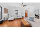 Bright living room with hardwood floors, a large sectional sofa, and stylish decor for a modern home interior at 207 Linden Ave, Raleigh, NC 27601