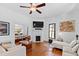 Bright living room with hardwood floors, a ceiling fan and views into the dining room at 207 Linden Ave, Raleigh, NC 27601