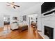 Open living room with hardwood floors, leading to the dining area and fireplace, perfect for entertaining at 207 Linden Ave, Raleigh, NC 27601