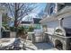 Outdoor kitchen with built-in grill and pizza oven at 207 Linden Ave, Raleigh, NC 27601