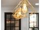 Close up of modern pendant lights hanging in the kitchen, above the kitchen island at 207 Linden Ave, Raleigh, NC 27601