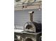 A stainless steel Alfa pizza oven on a stone counter at 207 Linden Ave, Raleigh, NC 27601