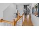 Bright staircase featuring wood stairs, white risers, and a unique black spiral staircase leading to the upper level at 207 Linden Ave, Raleigh, NC 27601