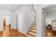 Bright hallway and staircase with hardwood floors at 207 Linden Ave, Raleigh, NC 27601