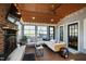 Bright sunroom with fireplace, TV, and a comfortable sectional at 207 Linden Ave, Raleigh, NC 27601